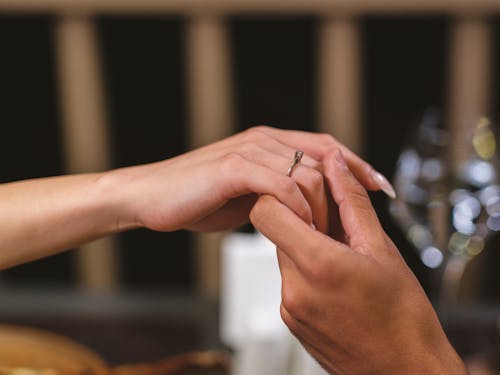 Close-up Shot of People Holding Each Others Hands