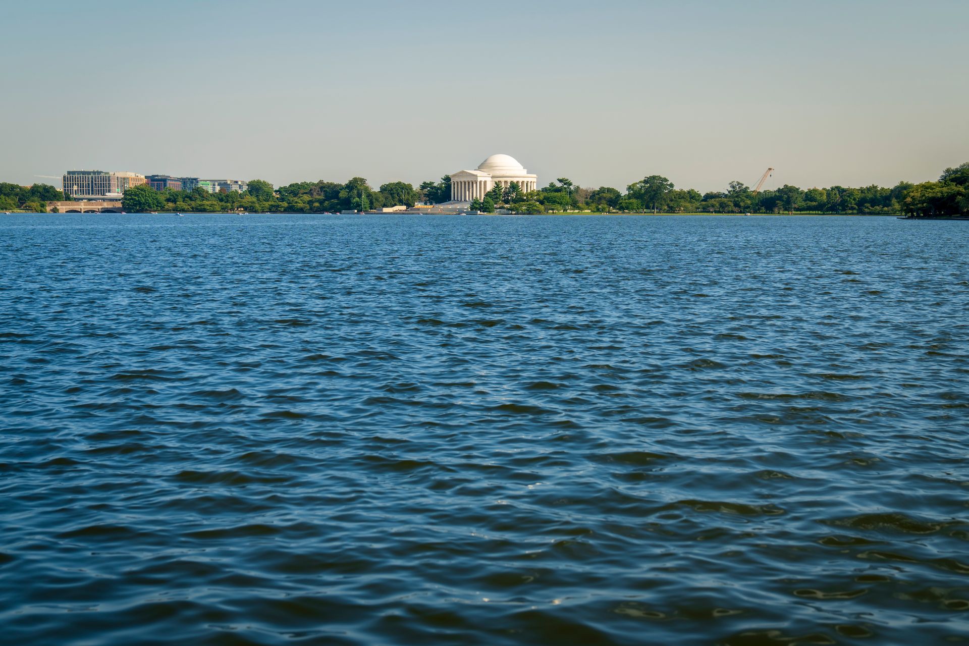View of the Thomas Jefferson Memorial and Tidal Basin in Washington, DC on a clear day.