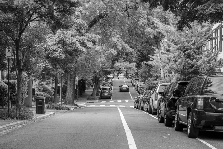 quiet residential street parked cars