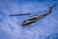 Blue and Yellow Helicopter in the Sky