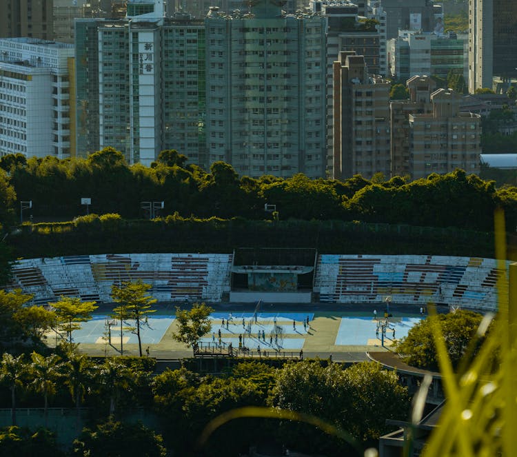 People On Stadium In City