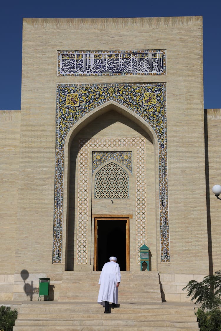 Man Walking Stairs To Mosque