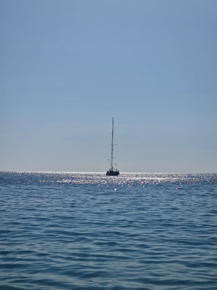 Photo Of A Boat On A Blue Ocean