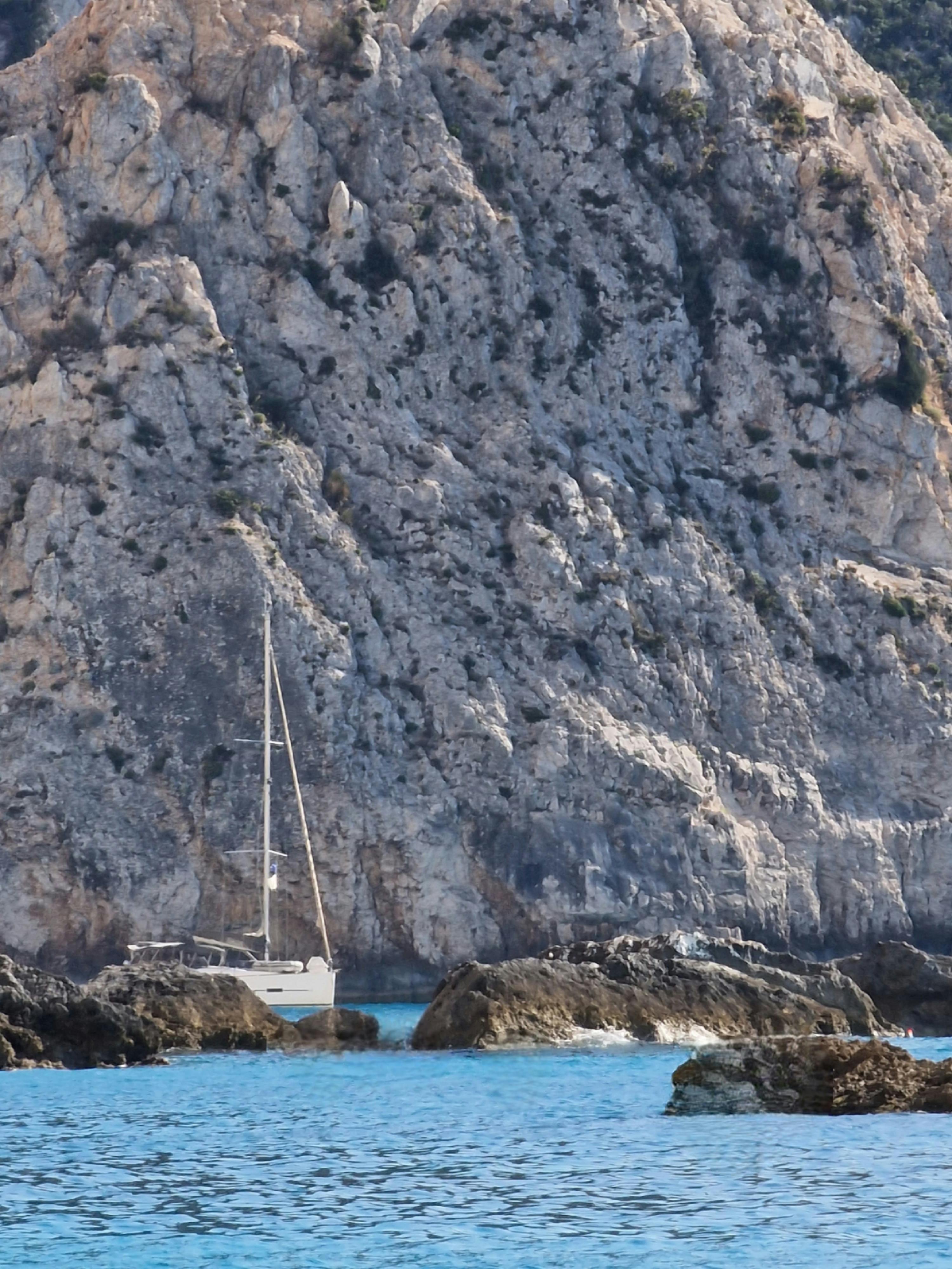 Photograph of an Orange and White Sailboat · Free Stock Photo