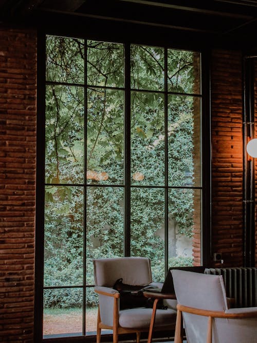 咖啡厅室内, 單人沙發, 垂直拍摄 的 免费素材图片