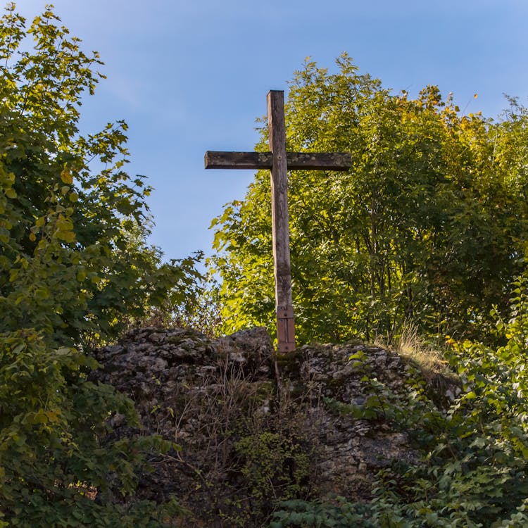 Free Brown Wooden Cross on Brown Rock Stock Photo