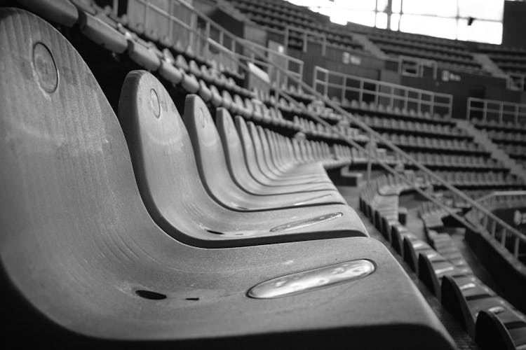 Grayscale Photo Of Empty Seats