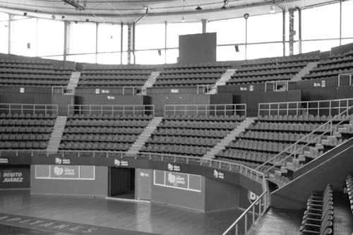 Grayscale Photo of an Empty Stadium