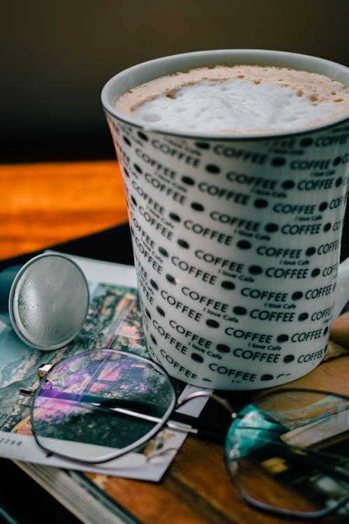 White and Black Cup with Coffee