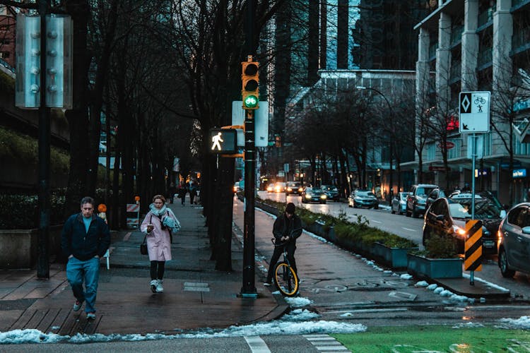 People Walking On Sidewalk