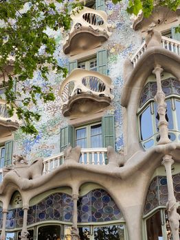 View of the unique façade of Casa Batlló, capturing its vibrant mosaic and organic forms in Barcelona.
