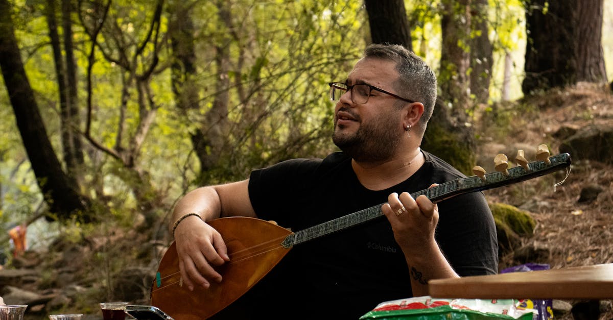 A Man Playing Stringed Instrument · Free Stock Photo