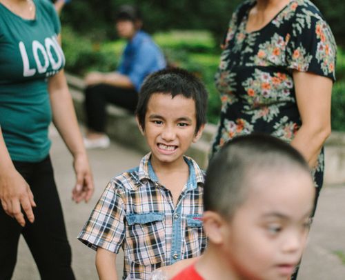 Free Smiling children enjoying a fun day outdoors with family. Stock Photo