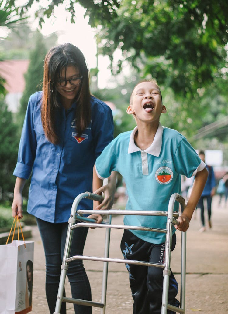 Laughing Boy Walking With Walking Frame