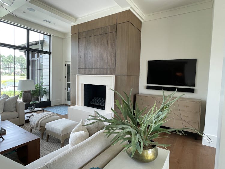 A Living Room With Furniture And Indoor Plant