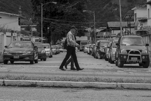 Grayscale Photo of People Walking on the Street