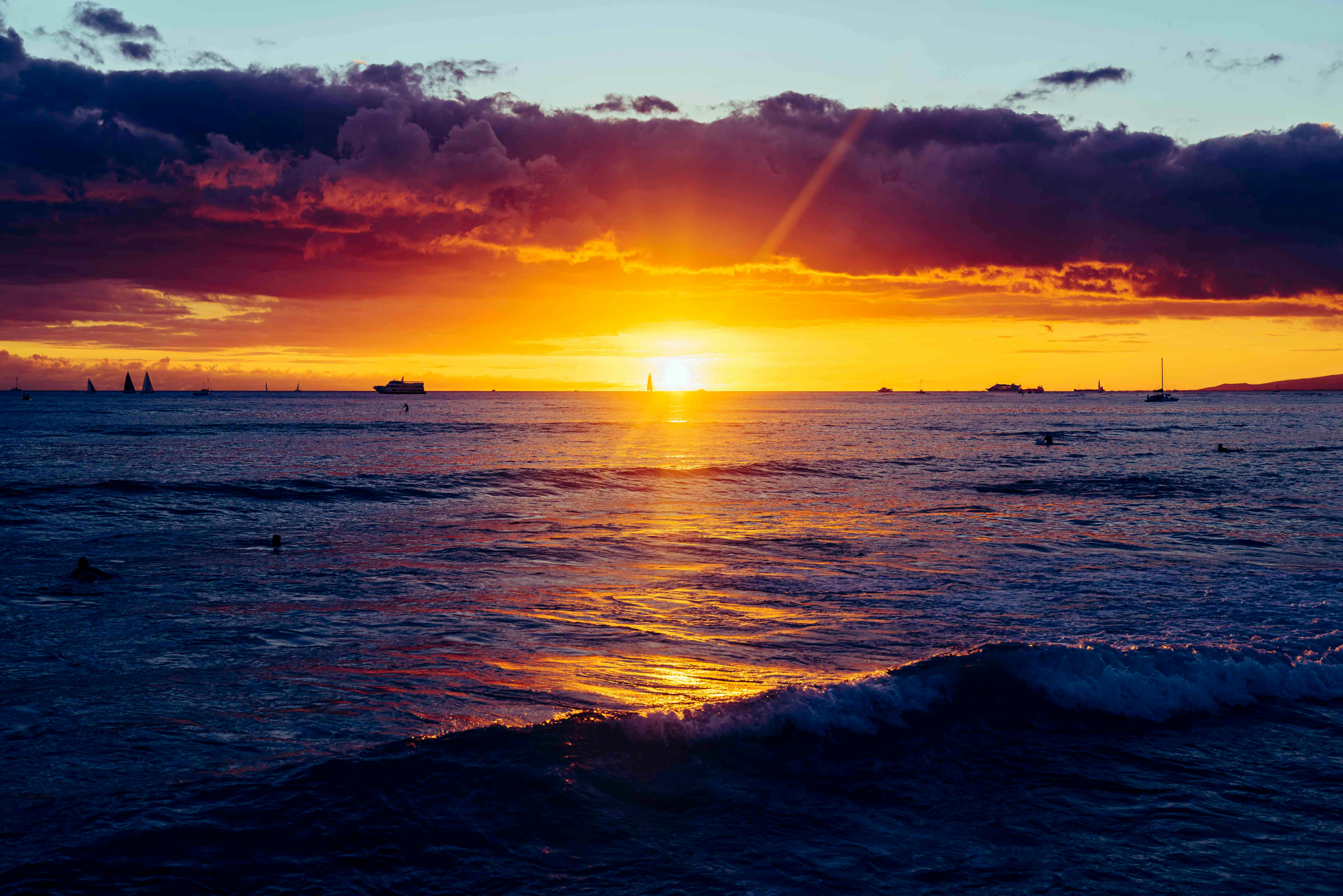 Captivating sunset view over Waikiki beach with vibrant colors and serene seascape, perfect for travel inspiration.