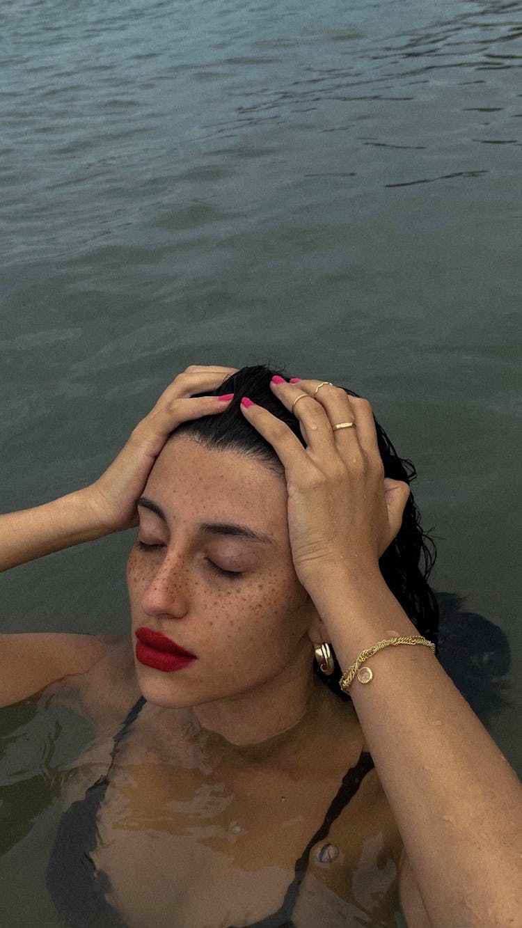 A Woman Swimming In The Ocean