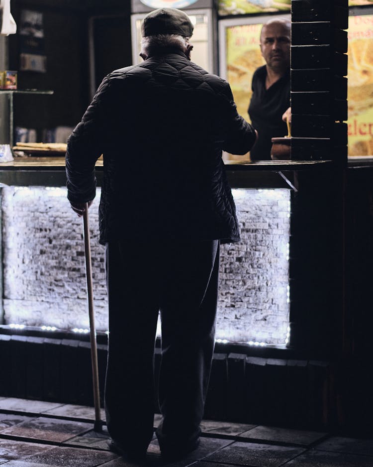 A Man Ordering On Counter