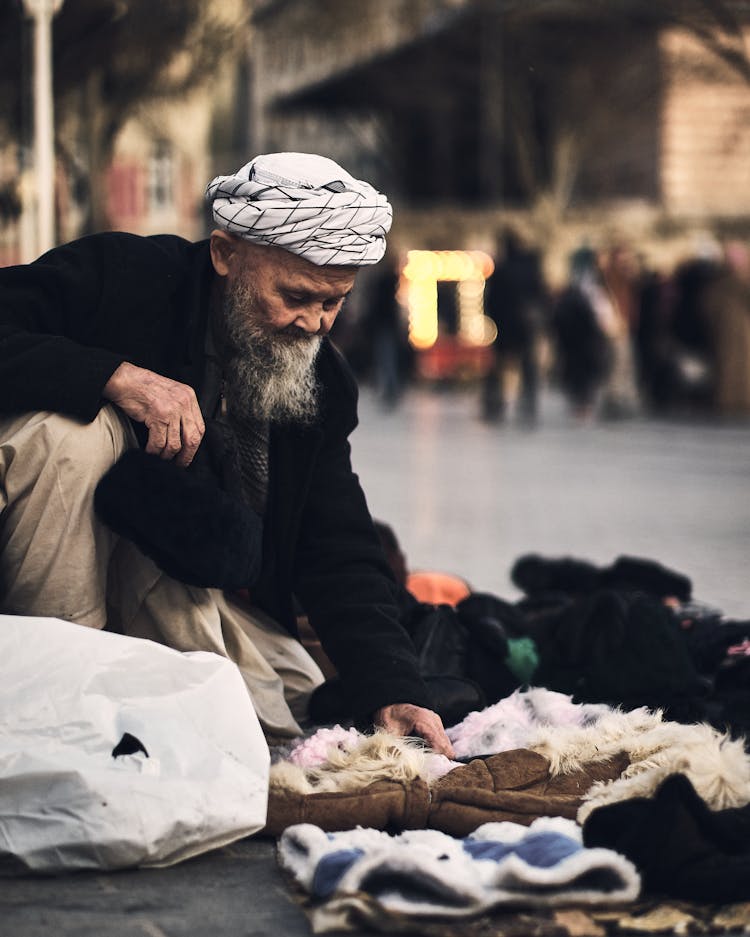 Old Bearded Man Selling On Street 