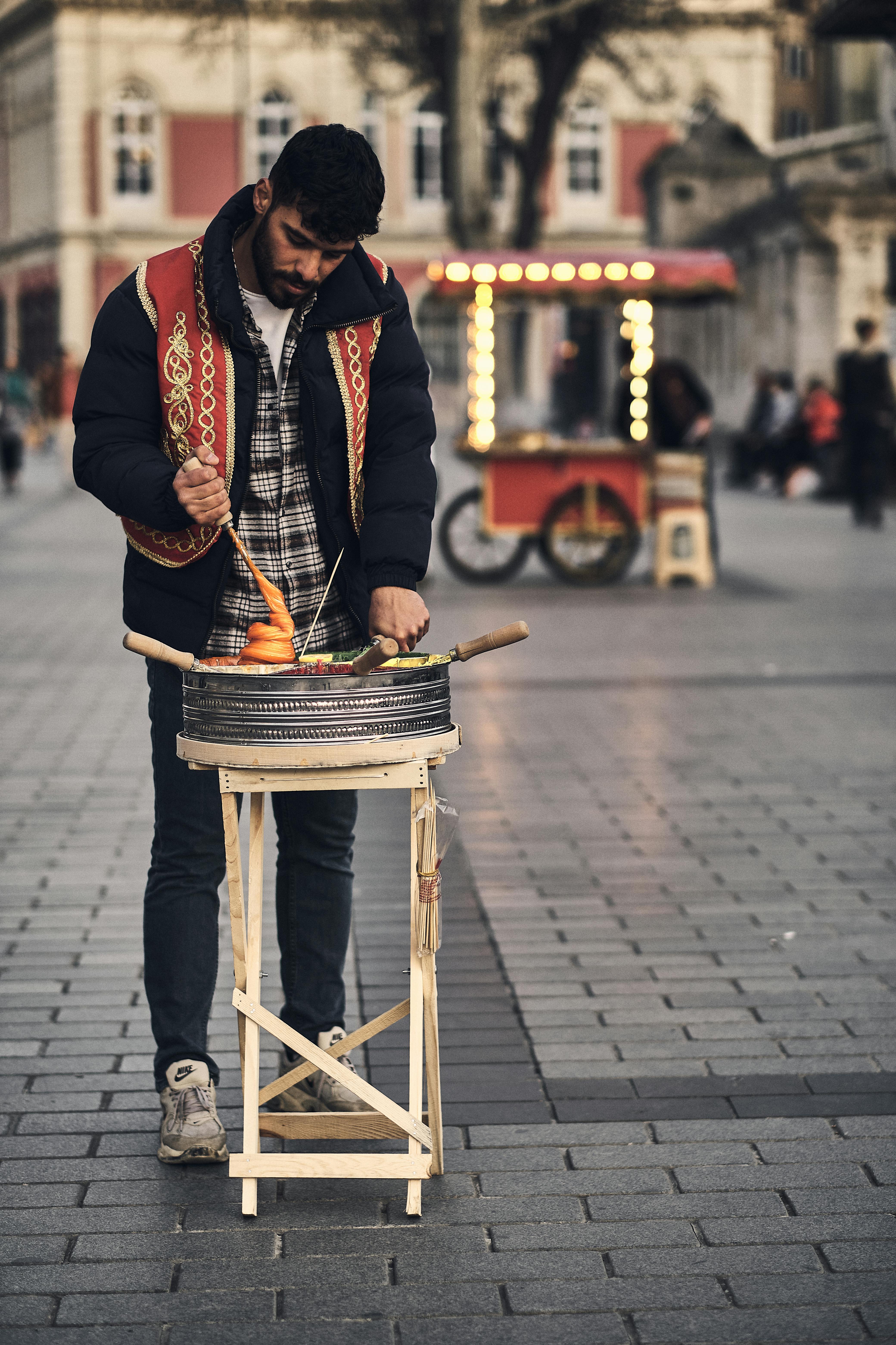 A Man Selling Food on the Street · Free Stock Photo