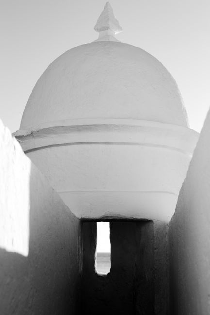 Monochrome photo showcasing a domed structure in Salvador, Brazil, with architectural details.