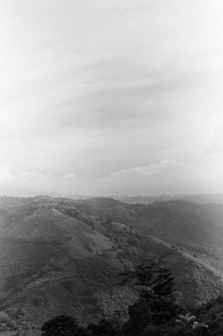 Clouds Over A Hilly Landscape