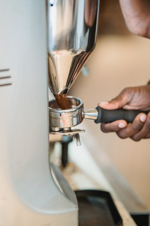 Barista Using Coffee Machine