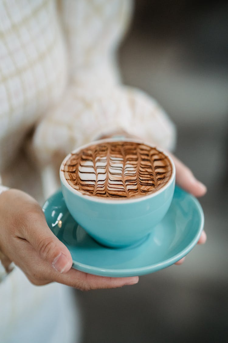 Close Up Of Woman Hands Holding Coffee Cup