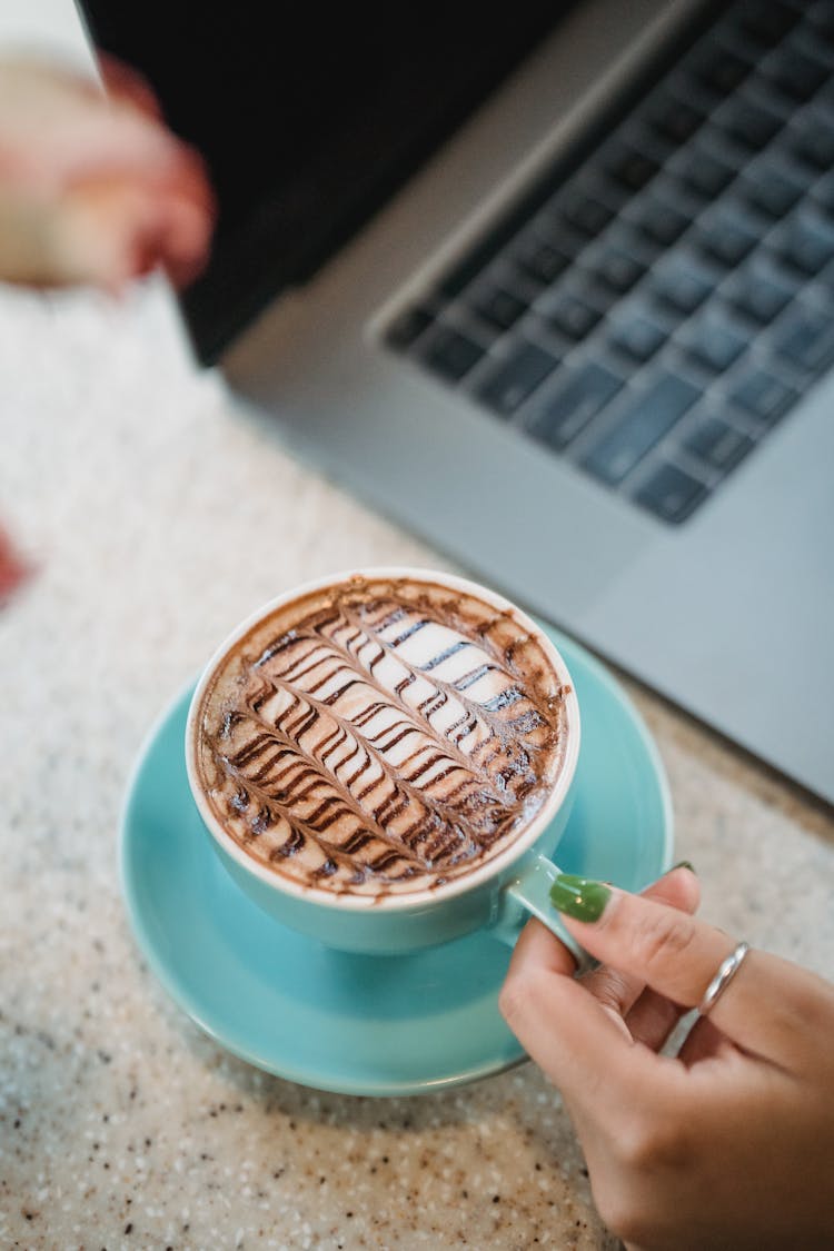 Close Up Of Woman Hands Holding Coffee Cup