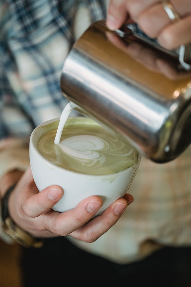 Pouring Milk To Coffee