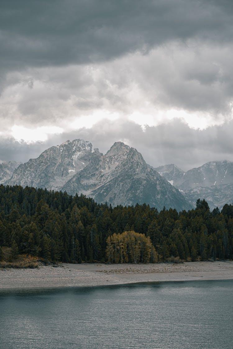 Landscape With Lake And Mountains And Overcast In Sky