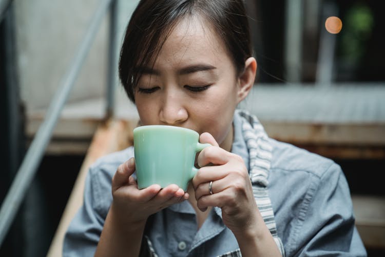 Woman Indulging During Coffee Break