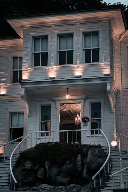 A White House with Stairs and Glass Windows