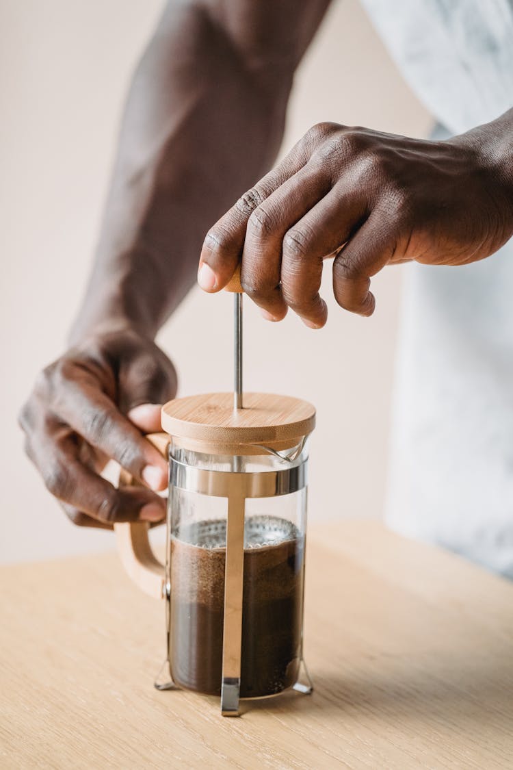 Man Making Coffee Using The French Press