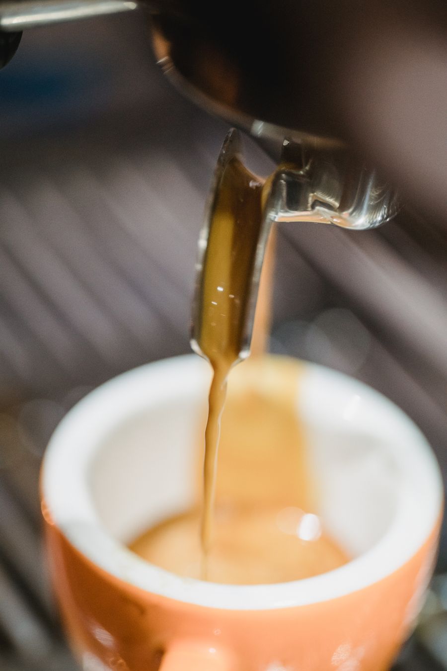 Espresso pouring into a cup