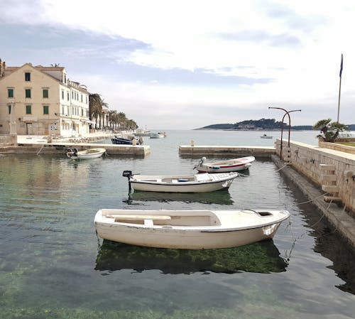 White Boats on Body of Water