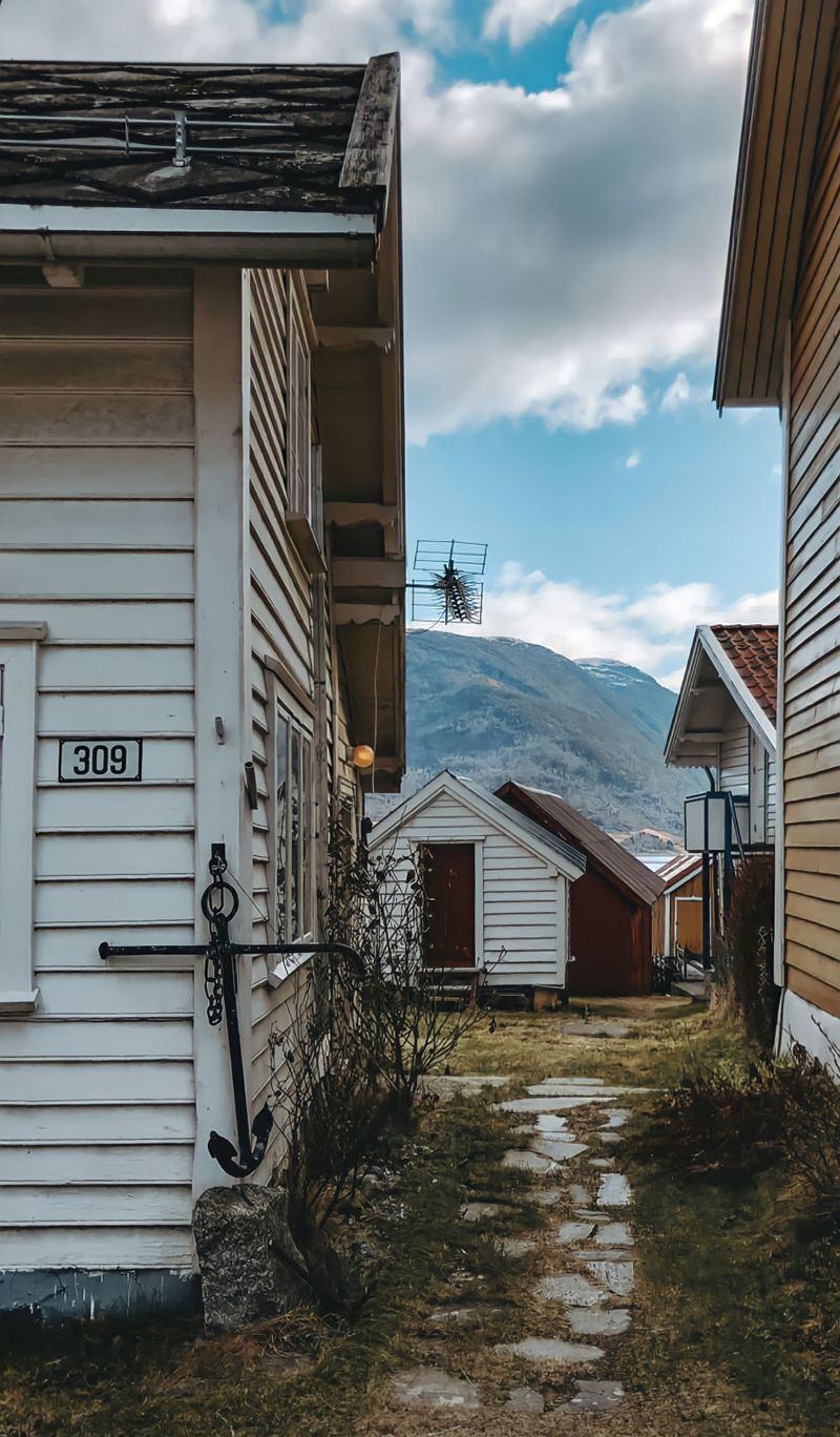 White timber houses in a fjord village