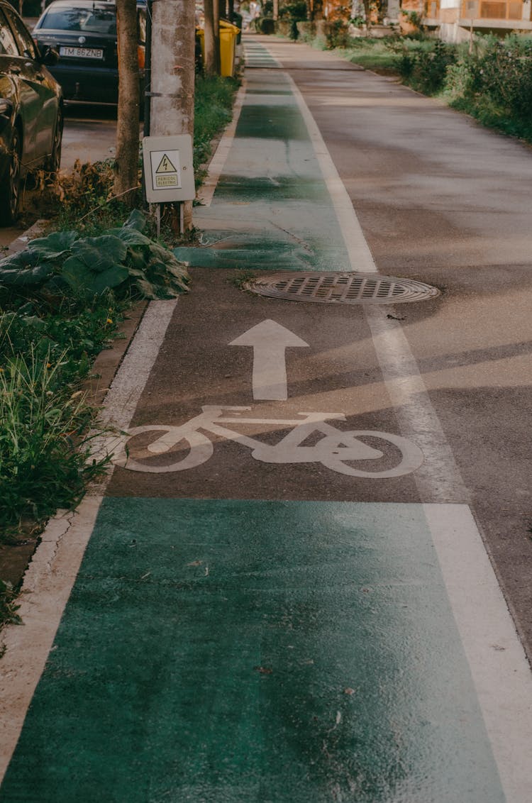 Bike Lane Symbol With A Direction Arrow On Ground