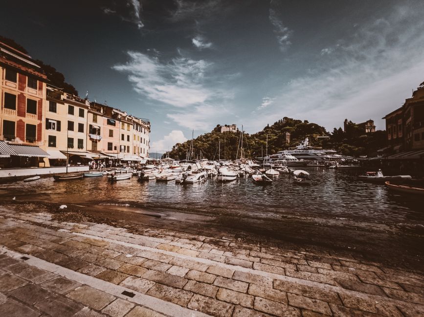 Outstanding Palermo Boat Tour with Snorkeling, Grotta Regina and Aperitif Review 2026 - Charming view of Portofino's harbor with boats docked beside colorful waterfront buildings.