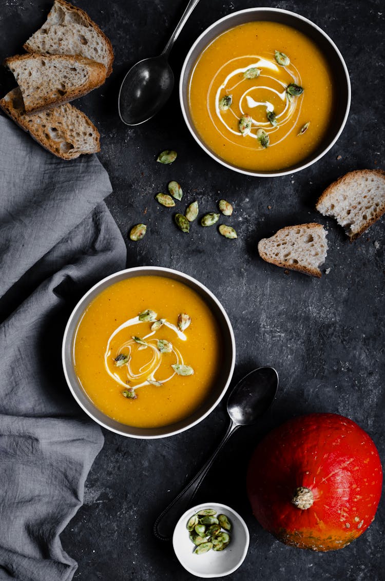 A Flatlay Of Bowls Of Pumpkin Soup