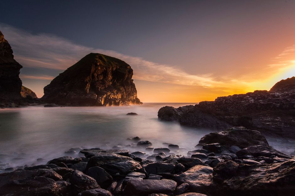 Breathtaking sunset over the rocky coastline of Cornwall, England.