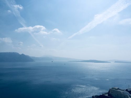 Free A breathtaking aerial view of Thera, Greece, showcasing the serene blue sea and picturesque islands. Stock Photo
