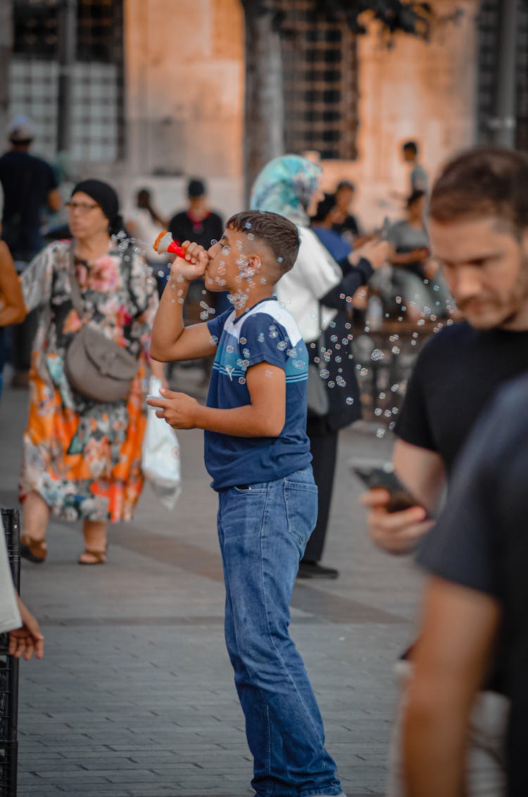 A Boy Blowing Bubbles