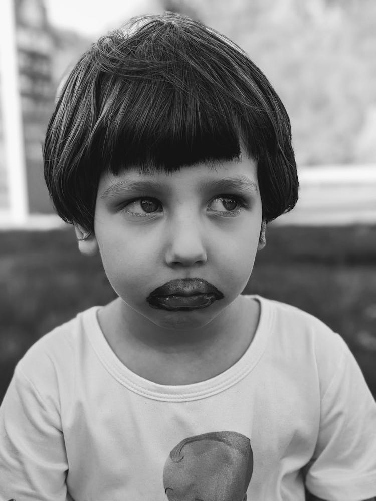 Black And White Photo Of A Child With Dirty Face