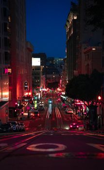 Explore the bustling nightlife of San Francisco streets, illuminated by vibrant neon lights.