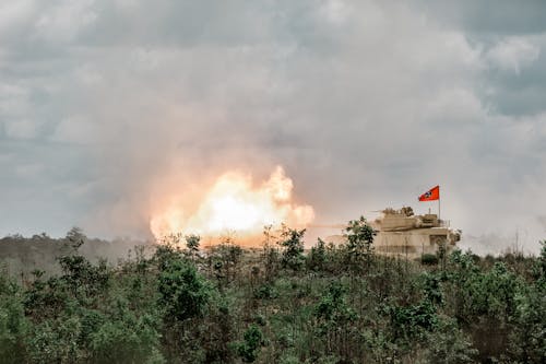 A1 Abrams Tank Firind a Round in a Firing Range