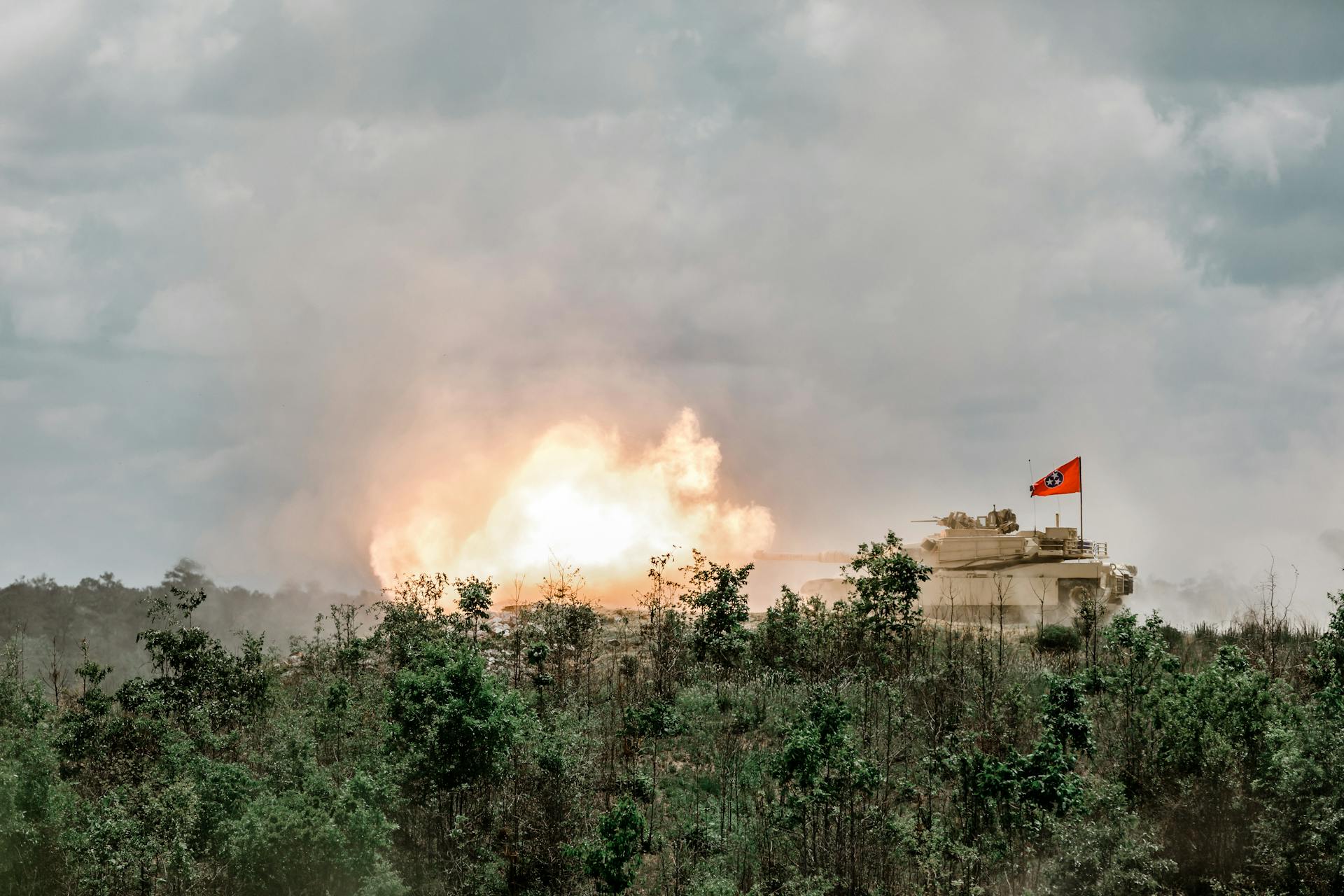 A1 Abrams Tank Firind a Round in a Firing Range