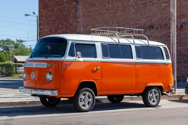 Orange Volkswagen Van On The Roadside