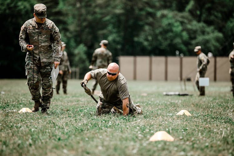 A Soldier Training On A Field